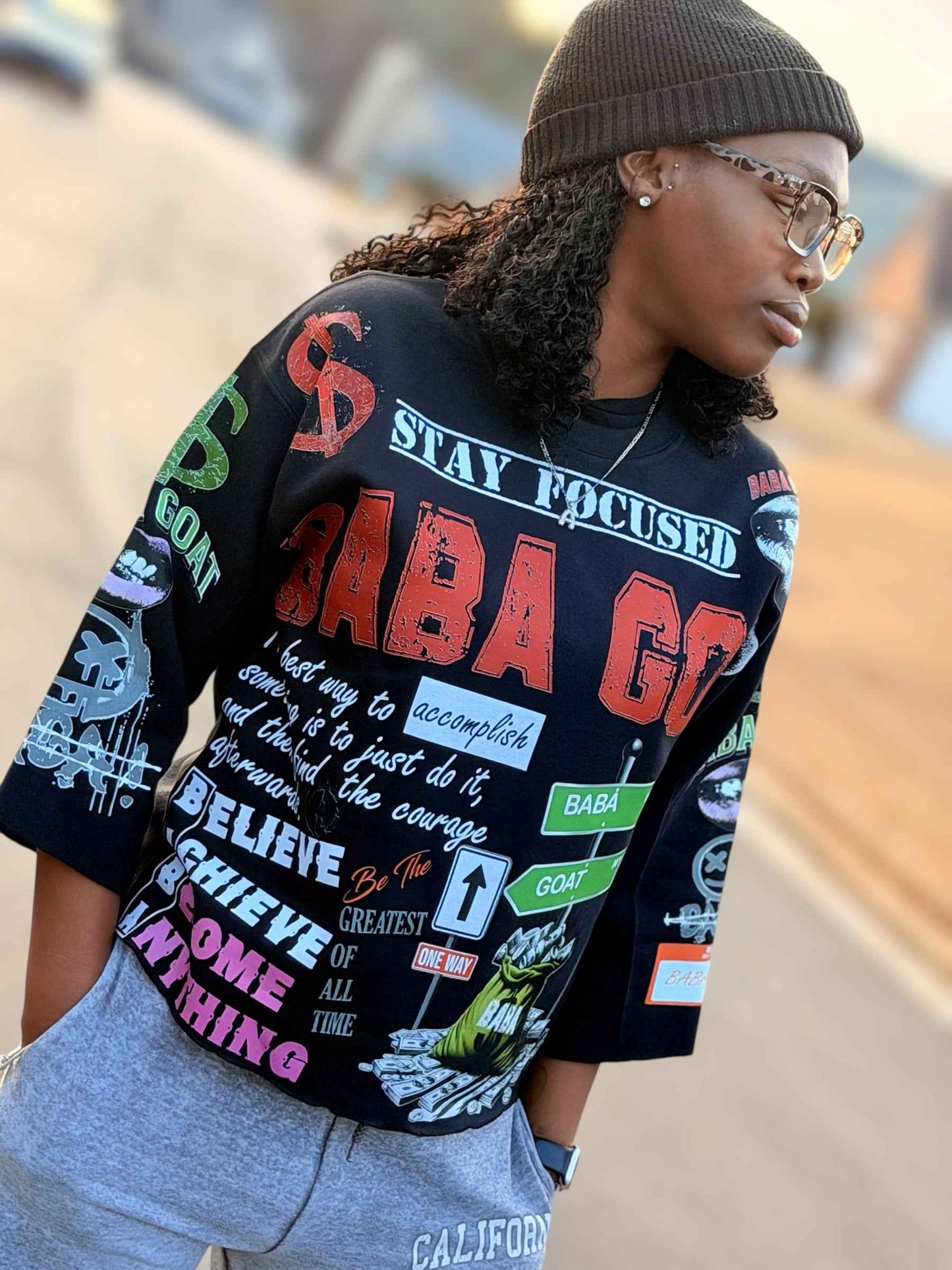 Street style lifestyle shot with graffiti message cropped sweater