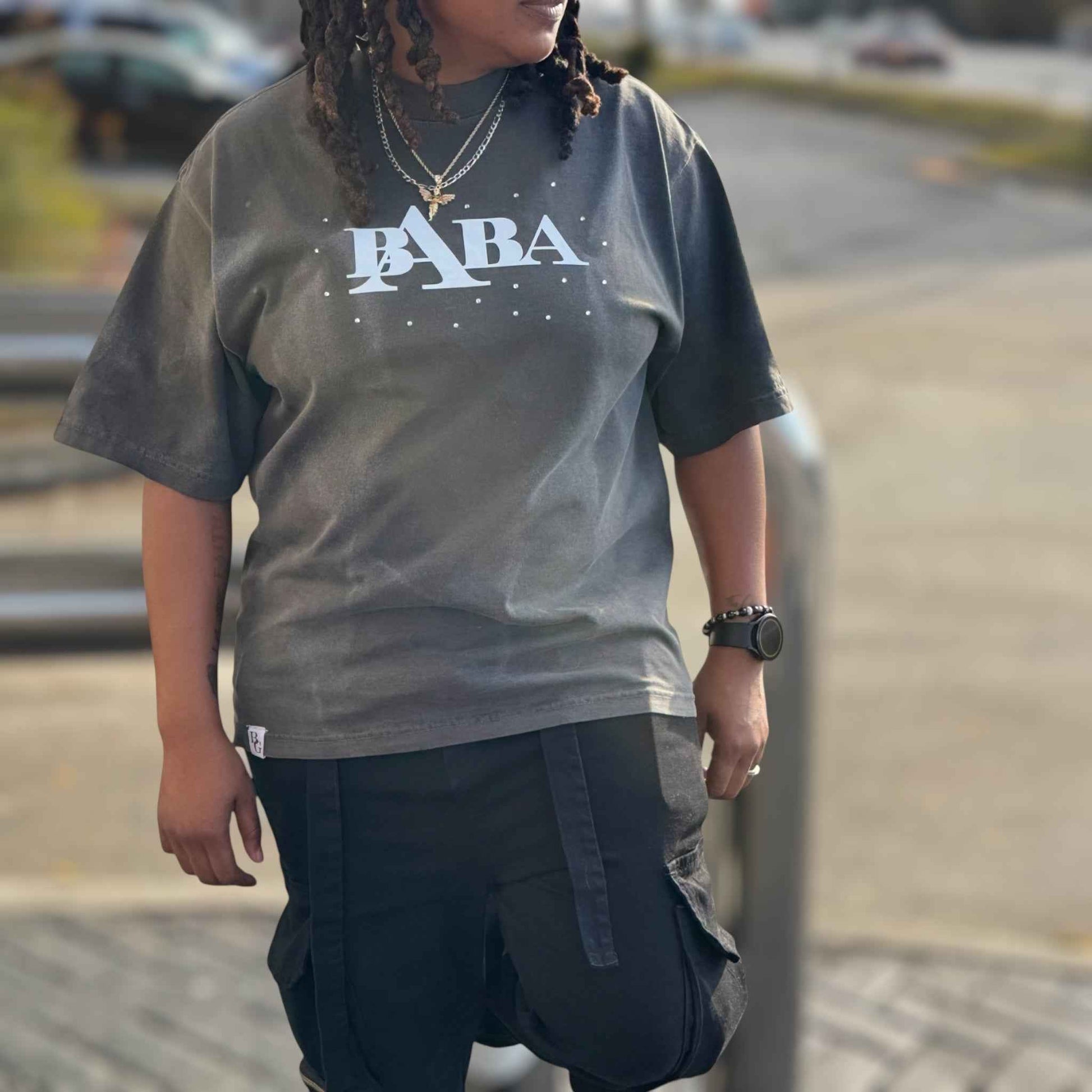 Model wearing oversized rhinestone graphic streetwear t-shirt